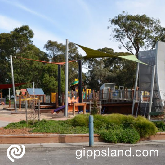 A large all abilities playground which includes a Liberty Swing, and the adjacent nature play space featuring wooden animal carvings and tree house