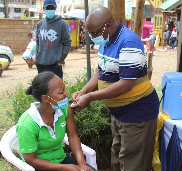 A resident receives a Covid-19 jab in Nyeri town