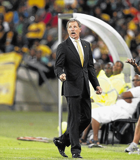 Chiefs' mentor Stuart Baxter, in a gold tie and black suit, Chiefs' colours, said taking instructions from the Bafana coach would make him an amateur