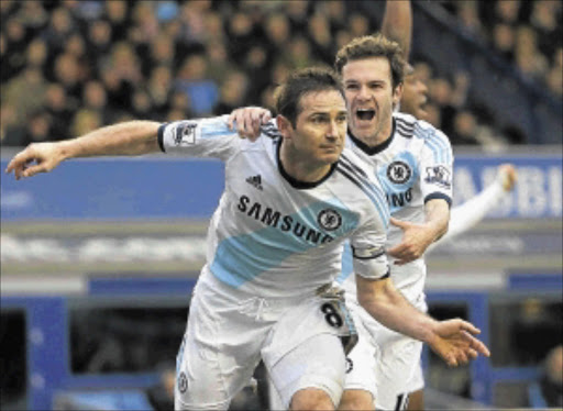 REVITALISED : Chelsea's Frank Lampard, left, celebrates scoring with Eden Hazard during their Premiership match at Goodison Park in Liverpool at the weekend. Photo: REUTERS