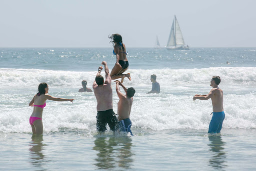 frolicking-in-surf-Venice.jpg - Friends frolic in the surf during a summer holiday in Venice Beach, California. 