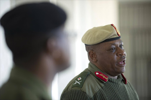 Lesotho's army Major General Lineo Poopa after weapons (unseen) confiscated from the police after the military raided police installations are put on display. Picture Credit: AFP