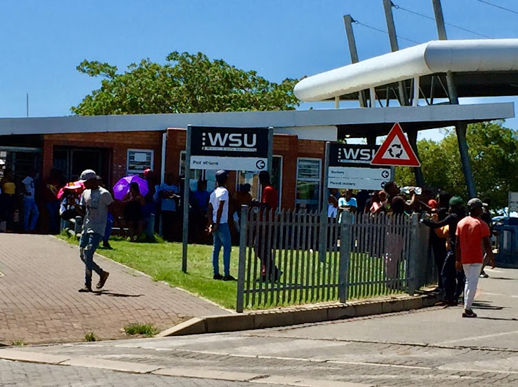 DEADLOCK: Students mill around outside WSU's Butterworth campus, having been denied entry to the university by security personnel.