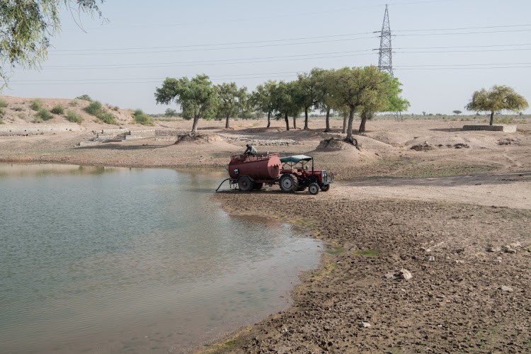 A tanker driver collects water near Samlani Nagar village in the state of Rajasthan, India, March 31 2024. Picture: REBECCA CONWAY/GETTY IMAGES