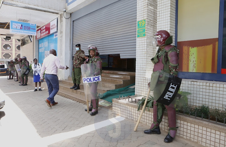 A man is denied entry at one of the entry points of Anniversary Towers when a section of Azimio Coalition leaders and supporters moved to protest the move by the electoral agency to interdict the agency's deputy CEO Ruth Kulundu at IEBC headquarters, Nairobi on September 26, 2022.