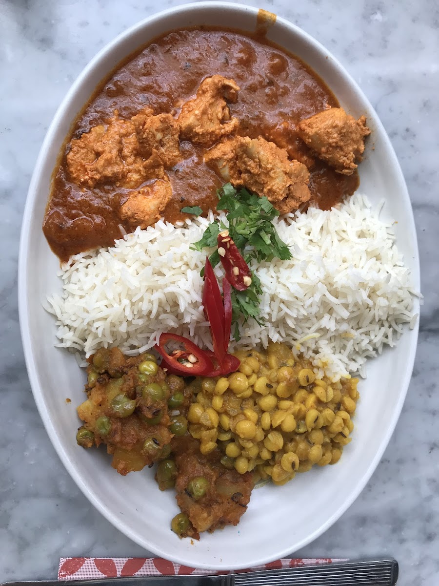 Chicken Tikka Masala with dal (lentils), potatoes and peas and basmati rice