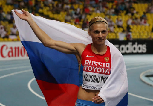 This file photo shows Russia's Antonina Krivoshapka celebrating after winning third place in the women's 400 metres final at the 2013 IAAF World Championships at the Luzhniki stadium in Moscow. Krivoshapka is one of five Russian athletes who have voluntarily admitted doping code violations, the country's track and field athletics federation (RusAF) said Wednesday 19 April 2017..