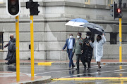 People walk to the funeral service of Archbishop Emeritus Desmond Tutu at St George's Cathedral in Cape Town, South Africa, January 1, 2022. 