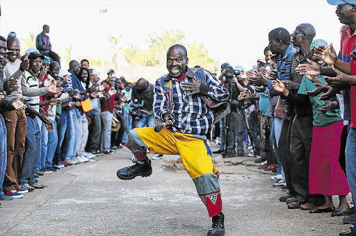 WAR FOOTING: A striking miner dances ahead of an address by Amcu president Joseph Mathunjwa in Marikana this week.