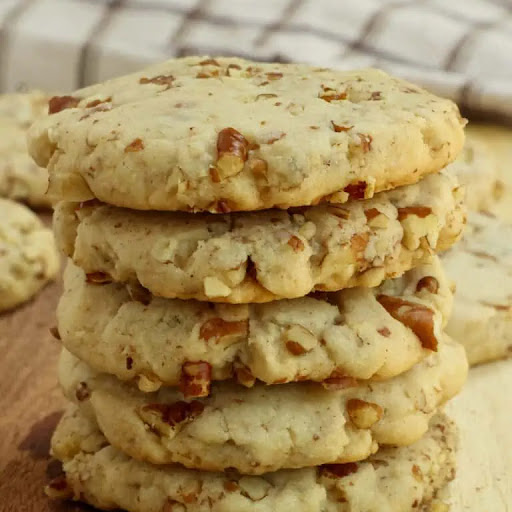 Easy Pecan Sandies are scrumptious buttery shortbread cookies with a healthy helping of chopped pecans. If you like shortbread cookies, these are a must-try! They are a tried and true friend and family favorite.