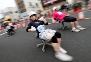 Racers compete in the office chair 'Isu' Grand Prix series in Hanyu, north of Tokyo, Japan, on June 9 2019.
