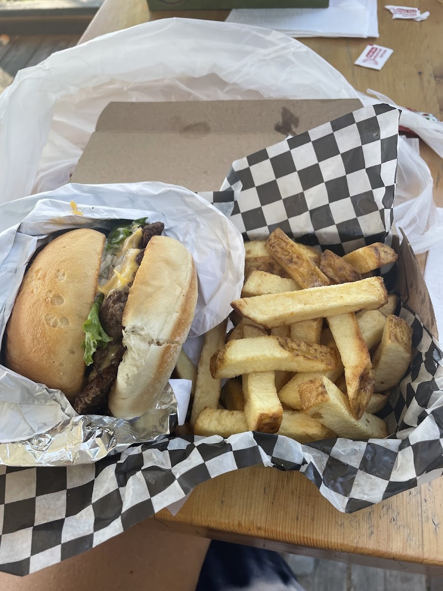 Classic cheeseburger with fries on a gluten free bun