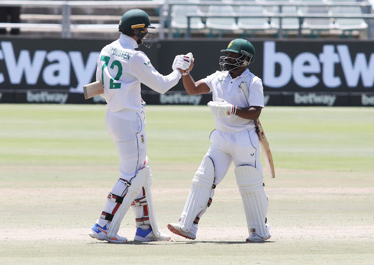 Proteas Temba Bavuma and Rassie van der Dussen celebrate the team's series win against India at Newlands on Friday.