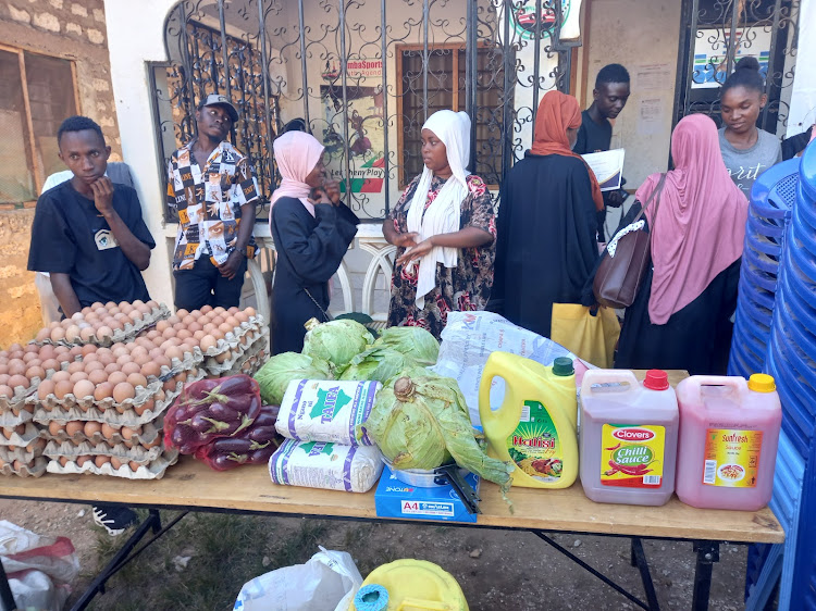 A section of youth assembles to receive business equipment at the Samba Sports Youth Agenda office in Matuag sub-county on Thursday, August 24, 2023.