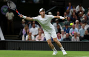 Andy Murray of Great Britain plays a forehand against James Duckworth of Australia in their first round match on day one of The Championships Wimbledon 2022 on June 27 2022.