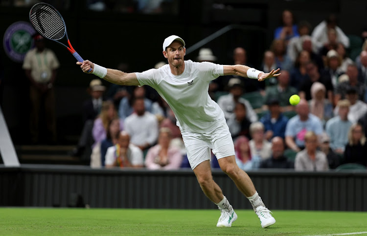 Andy Murray of Great Britain plays a forehand against James Duckworth of Australia in their first round match on day one of The Championships Wimbledon 2022 on June 27 2022.