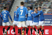 Ryan Jack of Rangers celebrates with teammates Bongani Zungu and Cedric Itten after scoring his team's fourth goal during the Ladbrokes Scottish Premiership match between Rangers Ross County at Ibrox Stadium on January 23, 2021 in Glasgow, Scotland. 