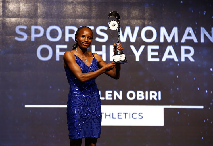 Obiri holds her trophy