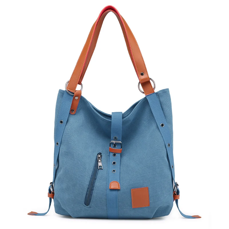 Bolso de mano de lona para mujer resistente y versátil ideal para el uso diario o viajes. Amplio compartimento y múltiples bolsillos interiores.
