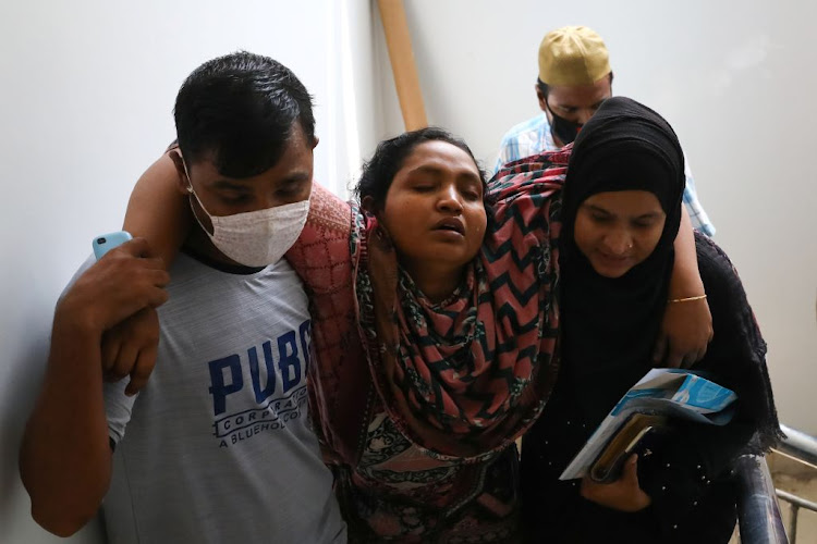 Relatives of victims mourn at a hospital, after a gas pipeline blast at a mosque in Narayanganj, near Dhaka, Bangladesh, on September 5 2020.