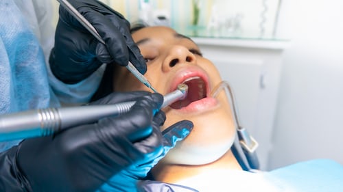 female getting a dental cleaning 