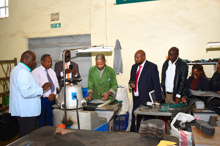 Isiolo county secretary Dade Boru, Tourism executive Lawrence Mwongela, Water executive Wario Sarite during a visit at YETU Leather factory on January 16