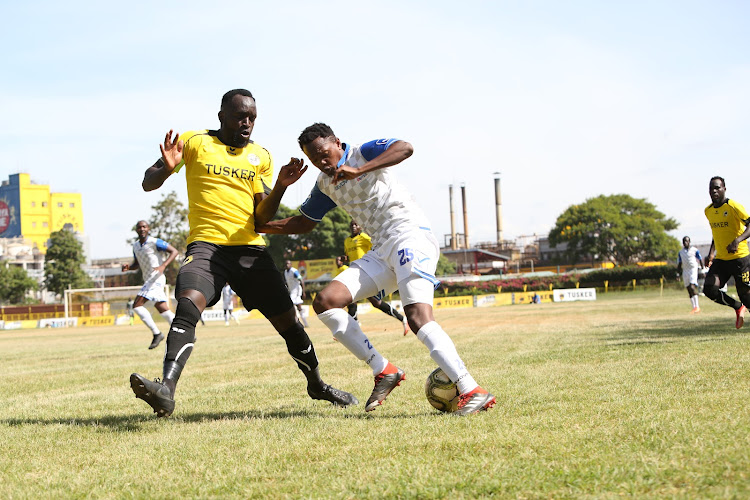 Bidco's David Gateri (R) in action against Tusker's Eugene Asike during their Kenyan Premier League match on Tuesday.