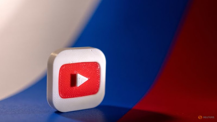 Youtube logo is placed on a Russian flag in this illustration picture taken February 26, 2022.