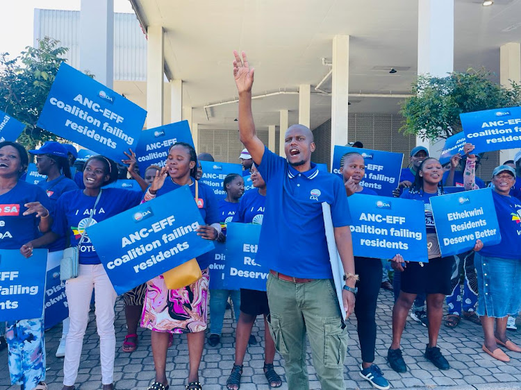 DA supporters outside the Durban ICC on Wednesday ahead of an eThekwini full council meeting which will vote on a dissolution of the council based on the ANC's 'failures'.