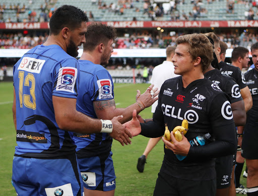 Curtis Rona of Western Force with Pat Lambie (R) of the Cell C Sharks during the Super Rugby match at Growthpoint Kings Park on May 06, 2017 in Durban, South Africa.