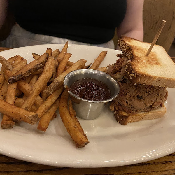 GF Pulled pork sandwich with fries.