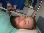 Campbell Easton, shot in the leg, crawled to a corner and took cover behind a table. He is now recovering in hospital.