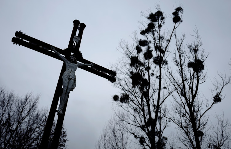 A cross near a church in Kalinowka, Poland. Picture: REUTERS/KACPER PEMPEL