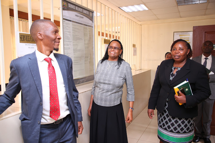 Chief Justice Martha Koome with Justice Nixon Sifuna and other judicial officers during her visit at Milimani Anti-Corruption Court on April 9, 2024.