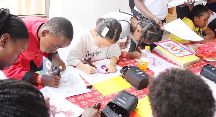 School children during a colouring session at the University of Nairobi on February 7. 2024.