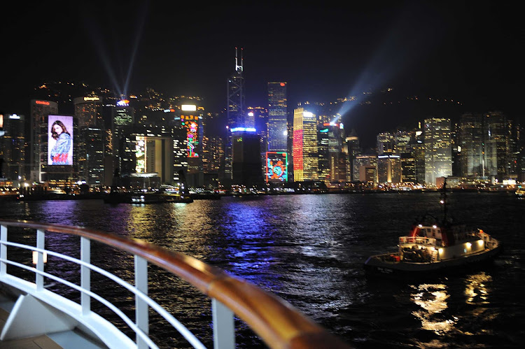 Enjoy the brilliantly lit skyline of Hong Kong on a Ponant cruise.