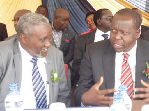 Nairobi County director of education Abdikadir Ali, Education cabinet secretary Fred Matiangi, and Nairobi School principal Paul Kibet during prize giving day in the school on Friday. Matiangi said the ministry has audited all 406 Kenya National Examinations Council's employees and dismissed 11 senior managers in the ongoing reforms of the exams agency ahead of this year's national tests/PHOTO BY JOSEPH NDUNDA