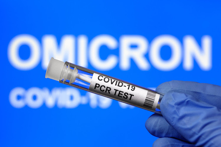 Omicron, a Covid-19 variant and coronavirus PCR test kit.