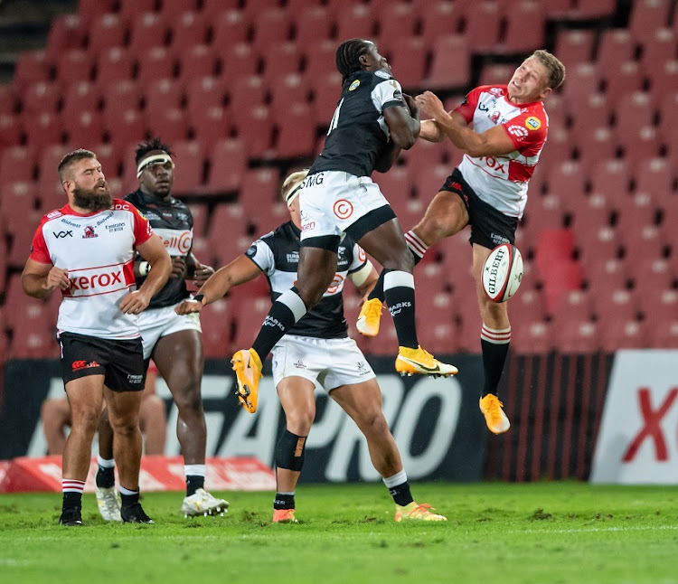 Yaw Penxe of the Cell C Sharks and Andre Warner of the XEROX Golden Lions in action during the Carling Currie Cup match between Xerox Lions and Cell C Sharks at the Emirates Airlines Park on December 19, 2020 in Johannesburg, South Africa.