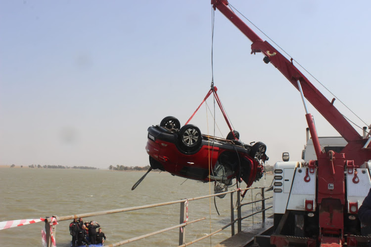 The vehicle crashed into steel barriers on the bridge and plunged into the water.