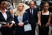 David Boies, representing several of Jeffrey Epstein's alleged victims, center, arrives with Annie Farmer, right, and Virginia Giuffre, alleged victims of Jeffrey Epstein, second left, at federal court in New York, U.S. in August 2019. 