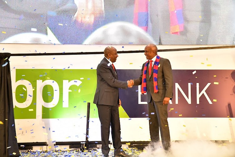 KCB Group PLC Chairman Andrew Wambari Kairu with Dr Édouard Ngirente, the Prime Minister of the Republic of Rwanda during the launch of BPR Bank Rwanda PLC On Wednesday in Kigali