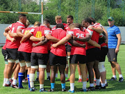 Junior Springbok coach Chean Roux watches on as the forwards are in a huddle during the Junior Springboks training at Lelo Arena on June 06, 2017 in Tbilisi, Georgia.