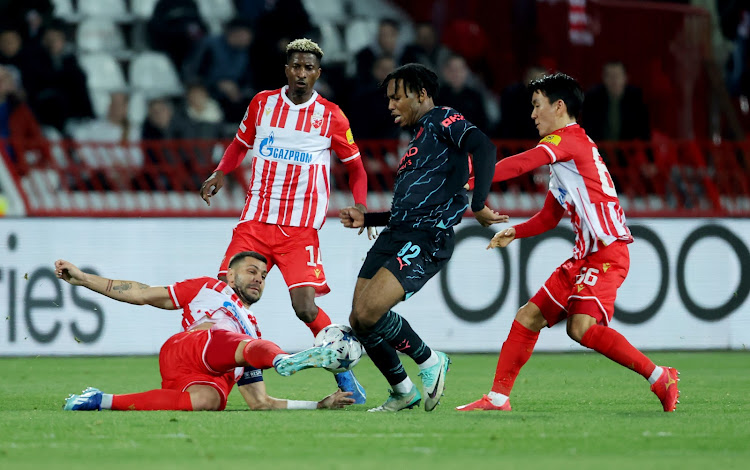 Manchester City’s Micah Hamilton (2nd R) vies for the ball with Red Star’s Aleksandar Dragovic (L), Peter Olayinka (2nd L), and Hwang Inbeom