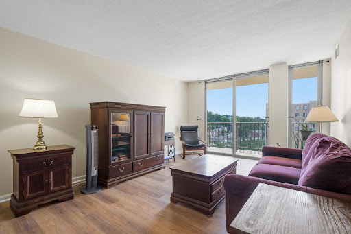 Living room furnished with trees view in this luxury apartment / penthouse for sale in Arlington ($262,000)