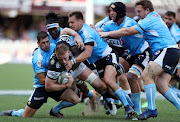 Jean-Luc du Preez of the Cell C Sharks tackled by Marnitz Boshoff and Ivan van Zyl of the Vodacom Blue Bulls during the Currie Cup Semi Final match between Cell C Sharks and Vodacom Blue Bulls at Growthpoint Kings Park on October 21, 2017 in Durban, South Africa. 