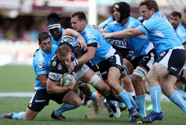 Jean-Luc du Preez of the Cell C Sharks tackled by Marnitz Boshoff and Ivan van Zyl of the Vodacom Blue Bulls during the Currie Cup Semi Final match between Cell C Sharks and Vodacom Blue Bulls at Growthpoint Kings Park on October 21, 2017 in Durban, South Africa.