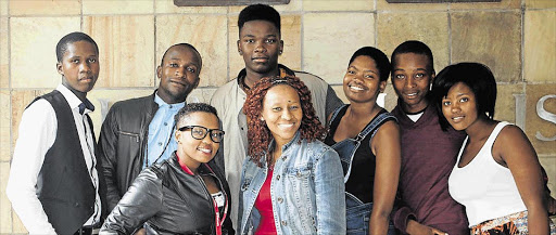 HELPING HAND: Good Samaritan Pumla Stuurman, centre, with some of the students she has helped get into Rhodes University Picture: SUPPLIED