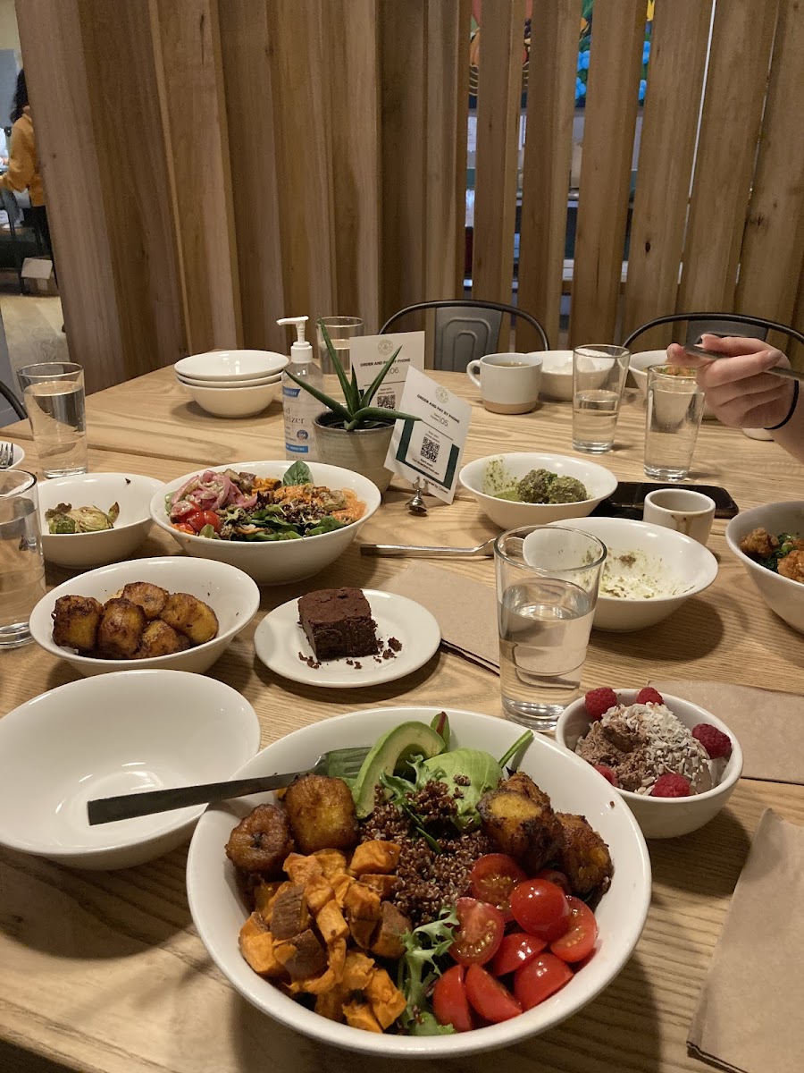 In the foreground: Fried plantains, quinoa, sweet potatoes, avocado, and mixed greens (a modified power bowl)
chocolate chia pudding to the right of the bowl, cassava brownie above the bowl