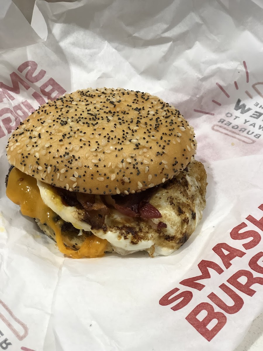 Breakfast burger with bacon, cheese and a fried egg.